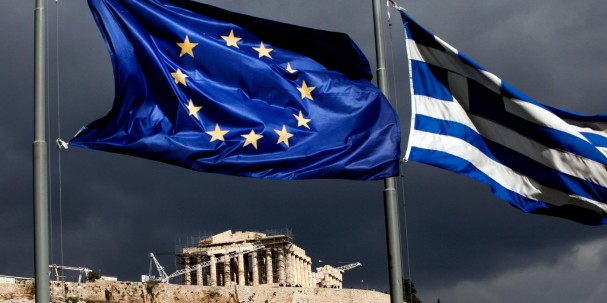 A European Union (EU) flag, left, and Greek national flag fly near the Parthenon temple on Acropolis hill in Athens, Greece, on Monday, Oct. 31, 2011. Europe's plan to solve the region's debt crisis made credit-default swaps covering Greece "ineffective," Moody's Investors Service said. Photographer: Angelos Tzortzinis/Bloomberg via Getty Images